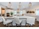 Gourmet kitchen with an island featuring bar seating and a stylish backsplash at 2653 Longleaf Pine Pt, New Port Richey, FL 34655