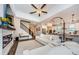 Open-concept living space with stairs, fireplace, and kitchen in a cohesive design at 2653 Longleaf Pine Pt, New Port Richey, FL 34655