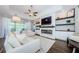 Cozy living room featuring a fireplace, built-in shelving, and a view of the outdoor patio at 2653 Longleaf Pine Pt, New Port Richey, FL 34655