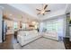Bright, open living room with stylish furniture and a seamless flow to the modern kitchen at 2653 Longleaf Pine Pt, New Port Richey, FL 34655