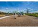 Community playground with a variety of climbing structures, swings, and slides at 2653 Longleaf Pine Pt, New Port Richey, FL 34655