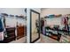 Large walk-in closet with ample storage space, shelving, and a full-length mirror at 2653 Longleaf Pine Pt, New Port Richey, FL 34655