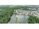 A neighborhood with houses and mature trees bordering a river and lush green preserve at 29542 Forest Glen Dr, Wesley Chapel, FL 33543