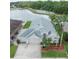 Beautiful home with a three car garage, complemented by lush landscaping and scenic lake views at 29542 Forest Glen Dr, Wesley Chapel, FL 33543