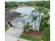 Beautiful home with a three car garage, complemented by lush landscaping and scenic lake views at 29542 Forest Glen Dr, Wesley Chapel, FL 33543