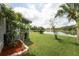 Beautiful backyard with access to a lake and a screened patio, blending indoor and outdoor living at 29542 Forest Glen Dr, Wesley Chapel, FL 33543