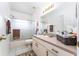 Bright bathroom with a shower/tub combo and a spacious vanity with storage at 29542 Forest Glen Dr, Wesley Chapel, FL 33543