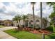Well-maintained home featuring lush landscaping, a three-car garage, and a welcoming facade at 29542 Forest Glen Dr, Wesley Chapel, FL 33543
