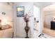 Hallway with doorways leading to a bedroom and bathroom, and featuring a decorative vase at 29542 Forest Glen Dr, Wesley Chapel, FL 33543