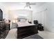 Spacious main bedroom with a vaulted ceiling, ceiling fan and a massage chair at 29542 Forest Glen Dr, Wesley Chapel, FL 33543