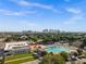 Stunning aerial view of a swimming pool and recreation area, set against the backdrop of a bustling cityscape skyline at 3008 N 13Th St, Tampa, FL 33605