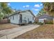 Charming home with a cozy backyard patio area, perfect for outdoor relaxation and entertaining at 3008 N 13Th St, Tampa, FL 33605