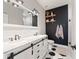Modern bathroom with a double sink vanity, stylish fixtures, and a beautifully tiled shower at 3008 N 13Th St, Tampa, FL 33605