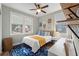 Cozy bedroom with bright windows, a blue rug, and white desk area at 3008 N 13Th St, Tampa, FL 33605