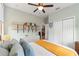 Bedroom with two closets, shelving, and a ceiling fan at 3008 N 13Th St, Tampa, FL 33605