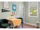 Charming dining area with a table, comfortable seating, and natural light from the window at 3008 N 13Th St, Tampa, FL 33605