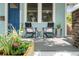 Close-up of a cozy front porch with chairs and decorative planters, adding charm and curb appeal at 3008 N 13Th St, Tampa, FL 33605