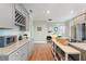 Bright kitchen with granite countertops, stainless steel appliances, and a wine rack for storage at 3008 N 13Th St, Tampa, FL 33605