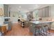 Spacious kitchen with gray cabinets, granite countertops, and a central island, perfect for entertaining at 3008 N 13Th St, Tampa, FL 33605