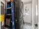 Modern laundry room with stackable washer and dryer and patterned floor tiles at 3008 N 13Th St, Tampa, FL 33605
