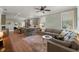 Spacious living room with a large sectional sofa, hardwood floors, and access to the kitchen area at 3008 N 13Th St, Tampa, FL 33605