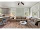 Bright living room with a large sectional sofa, marble coffee table, and natural light at 3008 N 13Th St, Tampa, FL 33605