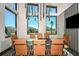 Well-lit conference room with modern seating and large windows offering a view of the surrounding community at 31356 Pendleton Landing Cir, Wesley Chapel, FL 33545