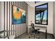 Modern office space with a comfortable chair, desk, and view of the pool area at 31356 Pendleton Landing Cir, Wesley Chapel, FL 33545