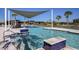 Community pool with swim up bar and relaxing lounge chairs at 31356 Pendleton Landing Cir, Wesley Chapel, FL 33545
