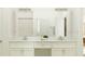 Elegant bathroom with double vanity, granite countertops, and modern fixtures, offering style and functionality at 31826 Griffin Sands Ln, San Antonio, FL 33576