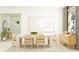 Elegant dining room with a modern table set for six, alongside stylish furnishings at 31826 Griffin Sands Ln, San Antonio, FL 33576