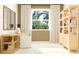 Bright office featuring a desk, shelving, and a large window, creating a serene workspace at 31826 Griffin Sands Ln, San Antonio, FL 33576