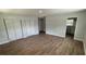 Large main bedroom with closet, vinyl wood floors and a neutral wall color at 3188 Lake Saxon Dr, Land O Lakes, FL 34639