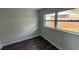 Cozy bedroom featuring a large window and neutral paint, allowing for ample natural light at 3188 Lake Saxon Dr, Land O Lakes, FL 34639
