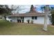 Charming single-story home featuring a well-maintained lawn and classic architectural details at 3188 Lake Saxon Dr, Land O Lakes, FL 34639