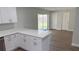 Updated kitchen with white cabinets, stone countertops, and stainless steel appliances at 3188 Lake Saxon Dr, Land O Lakes, FL 34639