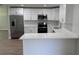 Bright kitchen featuring white cabinets, stainless steel appliances, and quartz countertops at 3188 Lake Saxon Dr, Land O Lakes, FL 34639