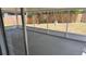 Screened patio overlooks a grassy backyard with a wood fence at 3188 Lake Saxon Dr, Land O Lakes, FL 34639
