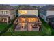 Aerial view of the backyard with a screened patio, perfect for outdoor living and entertaining at 3303 Monroe Meadows Dr, Odessa, FL 33556