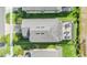 Aerial view of a home with skylights and a screened in lanai, overlooking a well maintained backyard at 3303 Monroe Meadows Dr, Odessa, FL 33556
