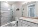 Modern bathroom with a glass-enclosed shower and vanity with stone countertop at 3303 Monroe Meadows Dr, Odessa, FL 33556