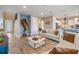 Bright living room featuring stylish decor, hardwood floors, and an open layout at 3303 Monroe Meadows Dr, Odessa, FL 33556