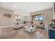 Spacious living room offering lots of natural light and seamless access to kitchen and dining area at 3303 Monroe Meadows Dr, Odessa, FL 33556