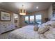 Bedroom featuring an ensuite bathroom and views of the water for a peaceful retreat at 3303 Monroe Meadows Dr, Odessa, FL 33556