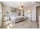 Tranquil main bedroom features a modern design, natural light, and a full-length mirror for dressing at 3303 Monroe Meadows Dr, Odessa, FL 33556
