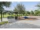Neighborhood playground with picnic area, shaded seating, and fun play equipment at 3303 Monroe Meadows Dr, Odessa, FL 33556