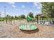 Community playground features swings, slide and picnic shelter for Gathering enjoyment at 3303 Monroe Meadows Dr, Odessa, FL 33556