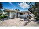 Charming backyard patio with barbecue grill and lush greenery at 333 Belleair Ne Dr, St Petersburg, FL 33704