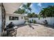 Well-maintained backyard with lush landscaping and a barbecue grill at 333 Belleair Ne Dr, St Petersburg, FL 33704