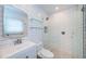 Bright bathroom featuring white subway tile, glass shower, and modern fixtures at 333 Belleair Ne Dr, St Petersburg, FL 33704